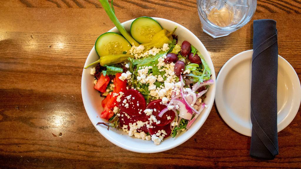 Greek Salad Bowl · Mixed greens, feta, beets, onion, tomato, kalamata olives and Greek olive oil dressing.