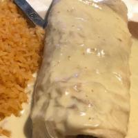 Burrito Fajita · Chicken or steak, cooked with onions, peppers and tomatoes. Smothered with cheese sauce, ser...