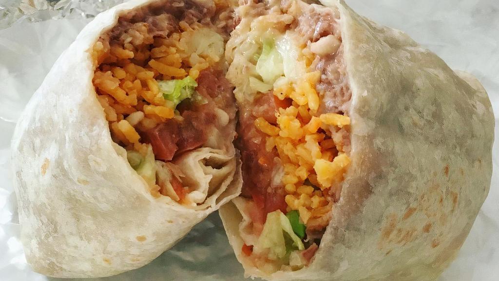 Burrito Tapatio · Chunks of steak rice and beans, sour cream, pico de gallo and guacamole. Wrapped around a large homemade flour tortilla.