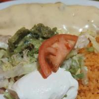 Chimichanga · A flour tortilla deep fried, filled with beef tips or chicken, fried beans and topped with n...
