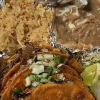 Birria Plate · 3 queso birria tacos on a bed of cabbage, rice, beans, side salad, the best consume