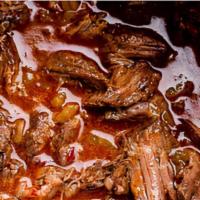 Beef Barbacoa (32 Oz) · Large pieces of tender beef in its juices, shreds beautifully once it's heated up.  Great on...