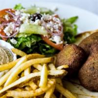 Falafel Plate · Vegetarian. Vegan. Dairy-free. Gluten-free.  Patties of ground chickpeas and fava beans, ble...