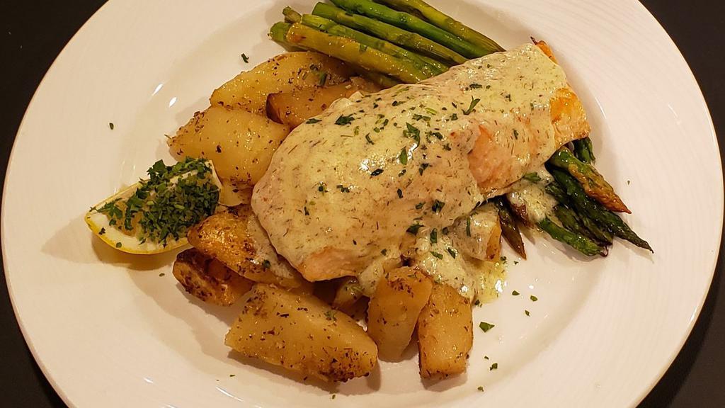 Salmon · Dairy-free. Gluten-free.  Fresh Atlantic salmon broiled with extra virgin Greek olive oil, lemon and spices, topped with lemon butter sauce, served with asparagus and Greek potatoes.