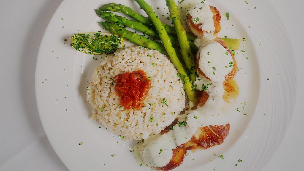 Santorini Scallops  · Dairy-free. Gluten-free.  Pan seared sea scallops, served with rice, marinara and lemon butter sauce, served with asparagus.