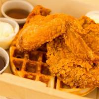 Chicken & Waffles · 3 pieces of fried chicken on a house-made waffle, served with maple syrup and whippped butter