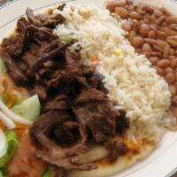 Beef Gyro Platter · Served with Greek salad, rice, beans, and pita bread.