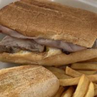 Cuban Sandwich With Fries · Baked pork, grilled ham, melted Swiss cheese, sliced pickles, mayo, and mustard on Italian b...
