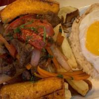 Lomo Saltado · Beef, red onions, tomato, green onion, cilantro french fries, and soy sauce mix. Served with...