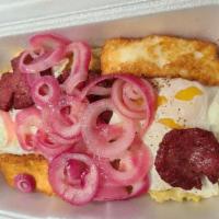 Mangu (Tres Golpes) · Mash plantain, served with salami, eggs, fry cheese, and onions.
