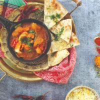 Goan Vindaloo · Spicy and tangy curry simmered with potatoes, colorful bell peppers, onions, roasted cumin, ...