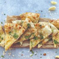 Garlic Naan · Garlic & cilantro coated leavened flatbread