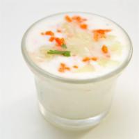 Raita · Yogurt sauce with cucumber, carrots, tomatoes, onions & cilantro.