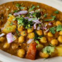 Chole Masala (Gf) (Vg) · Garbanzo beans simmered in our house made tomato & onion sauce and tempered with fresh ginge...