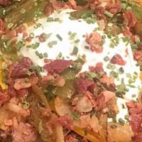 Pit Master Nachos · Tortilla chips topped with pulled pork or chopped brisket, queso, lettuce, shredded cheese, ...