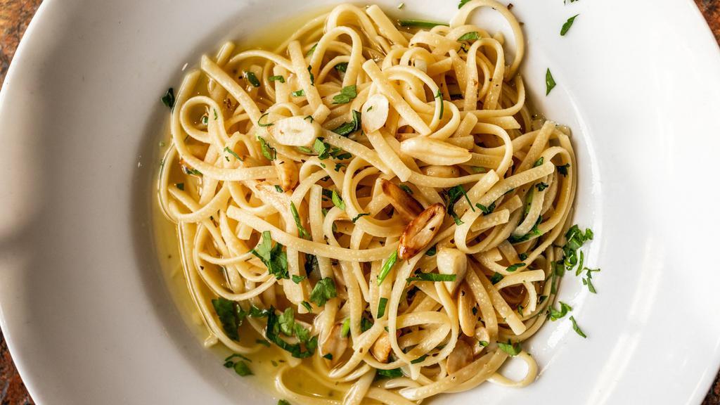 Linguini Alla Contadina · linguini pasta with broccoli, garlic, oil, hint of tomato, fine herbs, and spices.