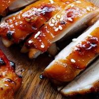 Char Grilled Teriyaki Chicken · Boneless chicken thighs marinated, char grilled just right, topped with homemade teriyaki sa...