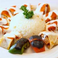 Chicken Beyti Kebab · Spicy Chicken Adana wrapped in lavash bread topped w/ yogurt sauce & chef's special sauce se...
