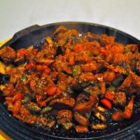 Coban Kavurma · Chunks of lamb sauteed w/ shallots, mushrooms, red & green peppers, tomatoes, with turkish s...