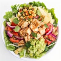 Southwest Mesquite Chicken Salad · Grilled mesquite chicken served on top of crisp greens with Jack cheese, guacamole, fiesta t...