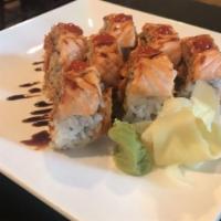 Spicy Baked Salmon Roll · BAKED
IN- Baked Spicy Salmon and Avocado
TOP- Salmon
SAUCE- Eel and Siracha
