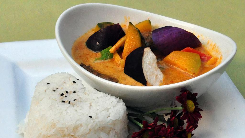 Pumpkin Curry · Vegan, spicy, gluten free. Pumpkin, eggplant, bell peppers, bamboo shoots and fresh basil in a red curry sauce.