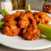 Chicken Wings · Ten breaded wing with your choice of sauce: mild, hot, BBQ, or plain.