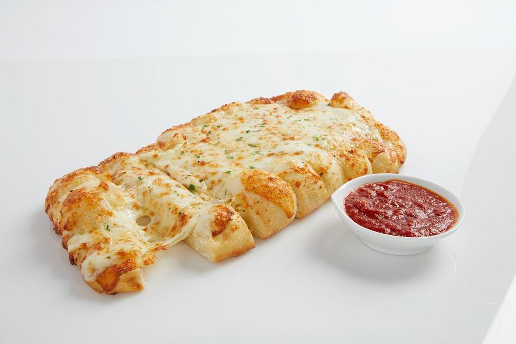 Garlic Cheesy Bread · Our homemade, fresh dough brushed with delicious garlic butter and topped with 100% whole milk mozzarella. Made fresh daily.