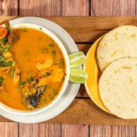 Sopa De Mariscos / Seafood Soup · Seafood soup made with crab, tilapia, muscles, shrimp, seafood mix and served with two corn-...