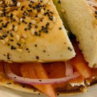 Bagel With Lox · Bagel with cream cheese, smoked salmon, cappers, onions, tomatoes and cucumbers! Do you wann...