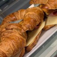 Croque Matin Cec · Butter croissant with egg and cheese (heated).