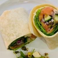 Smoked Salmon · Smoked salmon in a white tortilla cream cheese spread lettuce cucumber red onion and dill.