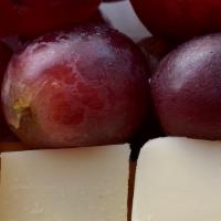 Grapes & Cheese · Cheddar mild cheese cut in cubes for easy on the go bite and red seedless grapes.