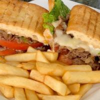 Steak & Cheese Sandwich · Sliced beef, onions, green peppers, lettuce, tomatoes, mayonnaise, and provolone.