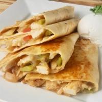 Steak Quesadilla · Two flour tortillas folded filled with cheese, tip tenderloin served with sour cream, and sa...