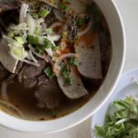 Bun Bo Hue / Spicy Beef Noodle Soup · Gluten-Free. Spicy lemongrass broth with beef shank, steak, and tendon.