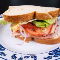 San Diegan · Ham, turkey, jack and cheddar cheese, lettuce, tomato, onion, mustard and mayo,  on your cho...