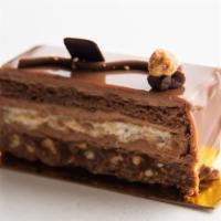 Chocolate Hazelnut Caramel · Chocolate cinnamon crust, caramel and toasted hazelnuts, praline buttercream, almond cake, c...