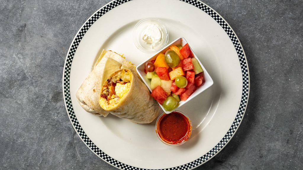 Breakfast Combo Burrito · Hash Brown, cheese, scrambled egg, and choice of meat. With fruit on the side