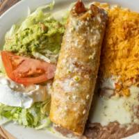 Chimichangas (Soft Or Fried) · Two flour tortillas filled with beef tips, chicken or shrimp with beans. Topped with lettuce...
