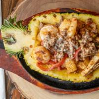 Fajitas Tropical · Pineapple, shrimp, steak, chicken, chorizo and vegetables.