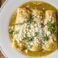 Enchiladas Suizas · Three enchiladas covered with green sauce and topped with cheese, onions and cilantro.