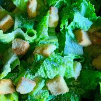 Caesar Salad · Romaine lettuce, Parmesan cheese, and croutons. Serve with Caesar dressing.
