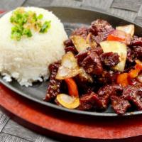 Shaken Beef · Sizzling beef, yellow onions, red bell peppers, jasmine rice.