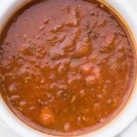 Cup Of Harira Soup · 8 ounce cup of Moroccan two bean soup (garbanzo/lentils), carrots, celery, onion, garlic, to...