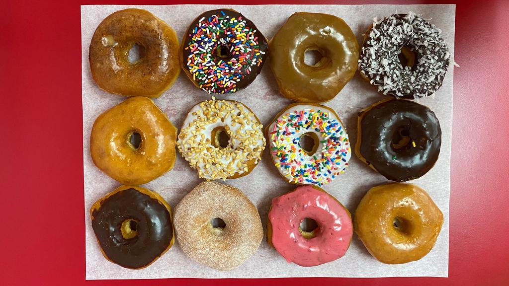 Donut Mix · Mix of glazed donut, chocolate donut, Cinnamon sugar donut, sprinkle donut, peanut, maple donut, strawberry donut,  and cinnamon glazed donut.