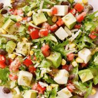 Fiesta Salad · Salsa fresca, field greens, avocado, aged cheddar, corn, black beans, crispy wontons, cilant...