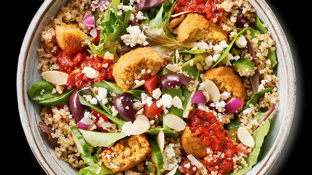 Mediterranean Bowl · Feta cheese, red onions, cucumber, quinoa, tomatoes, kalamata olives, cilantro, almonds, field greens, roasted red peppers, red pepper sauce