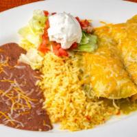 Beef Enchilada · 2 rolled corn tortillas with melted cheese served with refried beans, rice, lettuce, pico de...