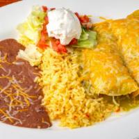 Seafood Enchilada · 2 rolled corn tortillas with melted cheese served with refried beans, rice, lettuce, pico de...
